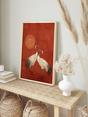 Japanese style crane wall art print featuring two white cranes with red crowns standing in red water under a red sun. - Image 3