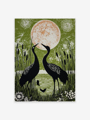 Two black cranes facing a large orange and white moon, surrounded by green reeds and water in an illustrative style