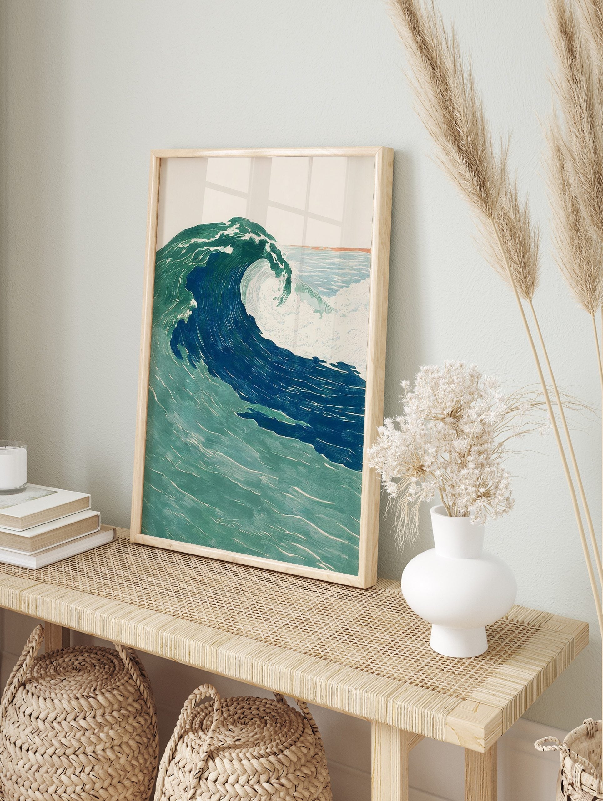 Illustrative ocean wave art print, large crashing wave in deep blue and green with white foam, in an alternate framed mockup
