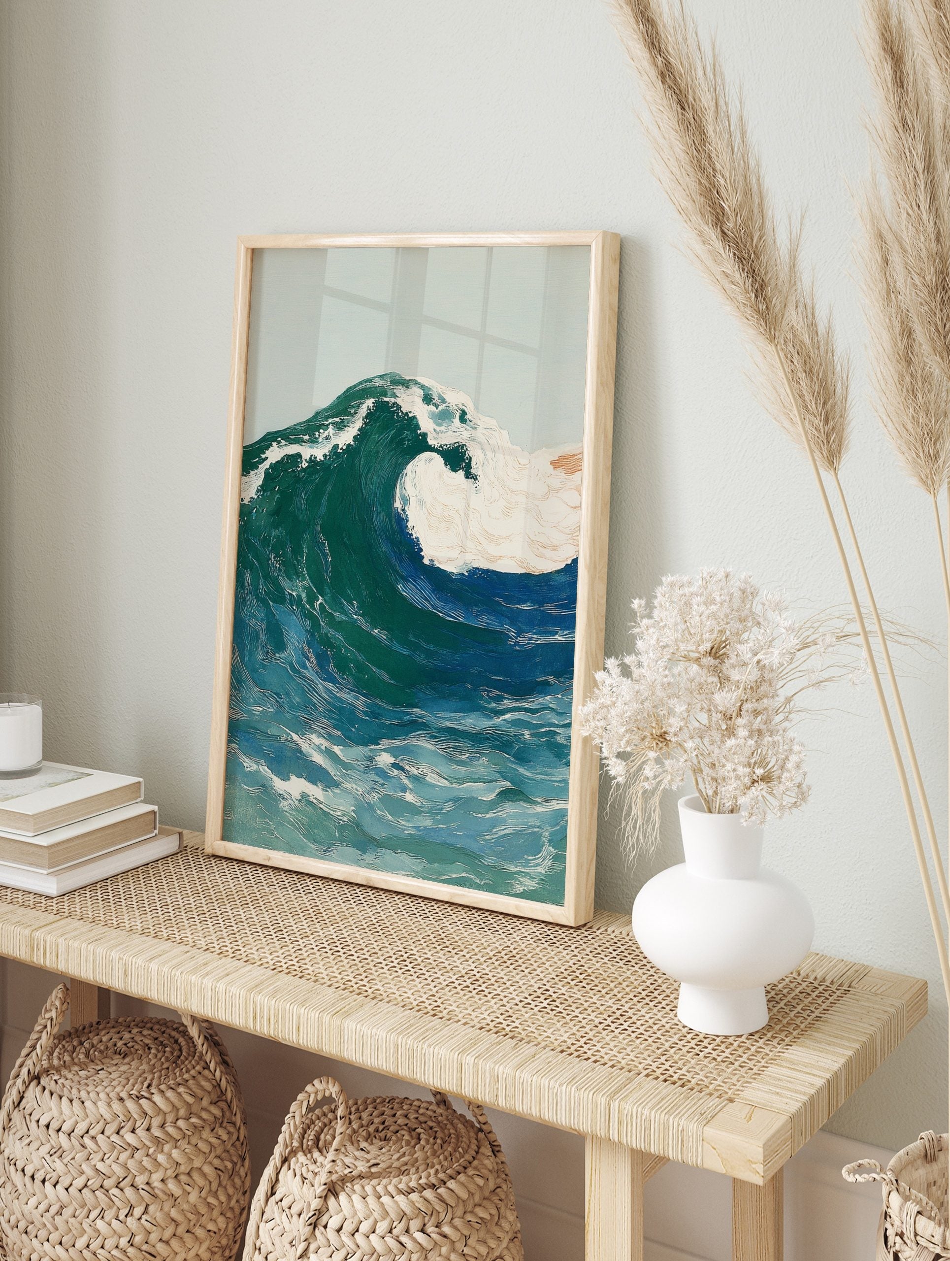 Illustrative art print of a large crashing ocean wave with blue, green, and white foam, in an alternate framed mockup