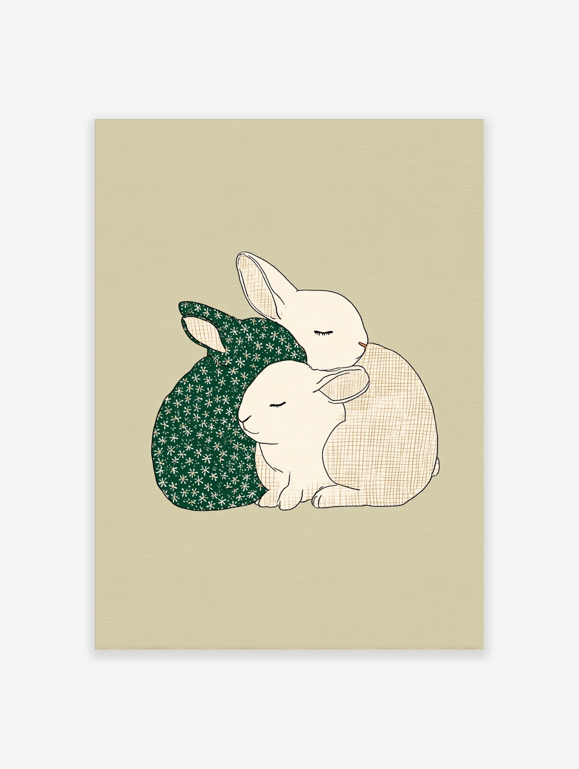 Illustrative print of two cuddling rabbits, one dark green with stars, one beige with a grid, on a light background