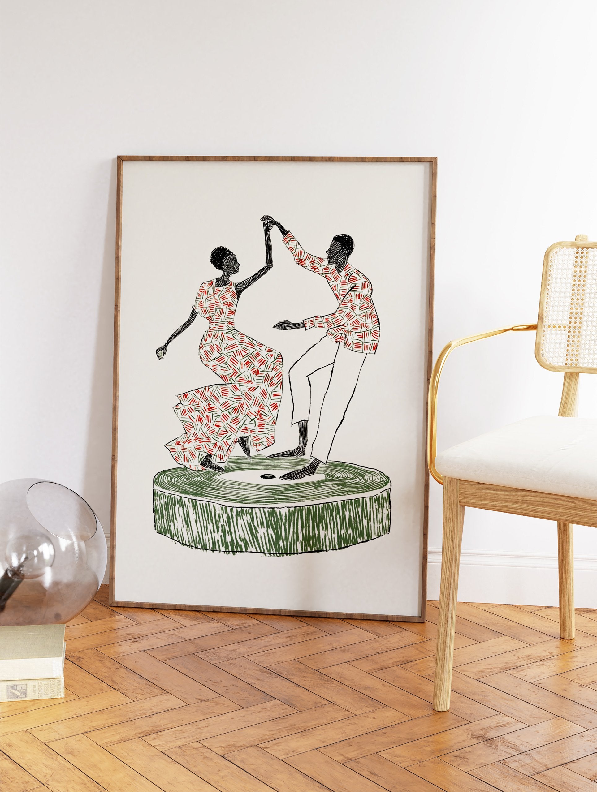Cultural Dance Art print depicting an African couple dancing on a green platform with red and green patterned clothes. - Image 2