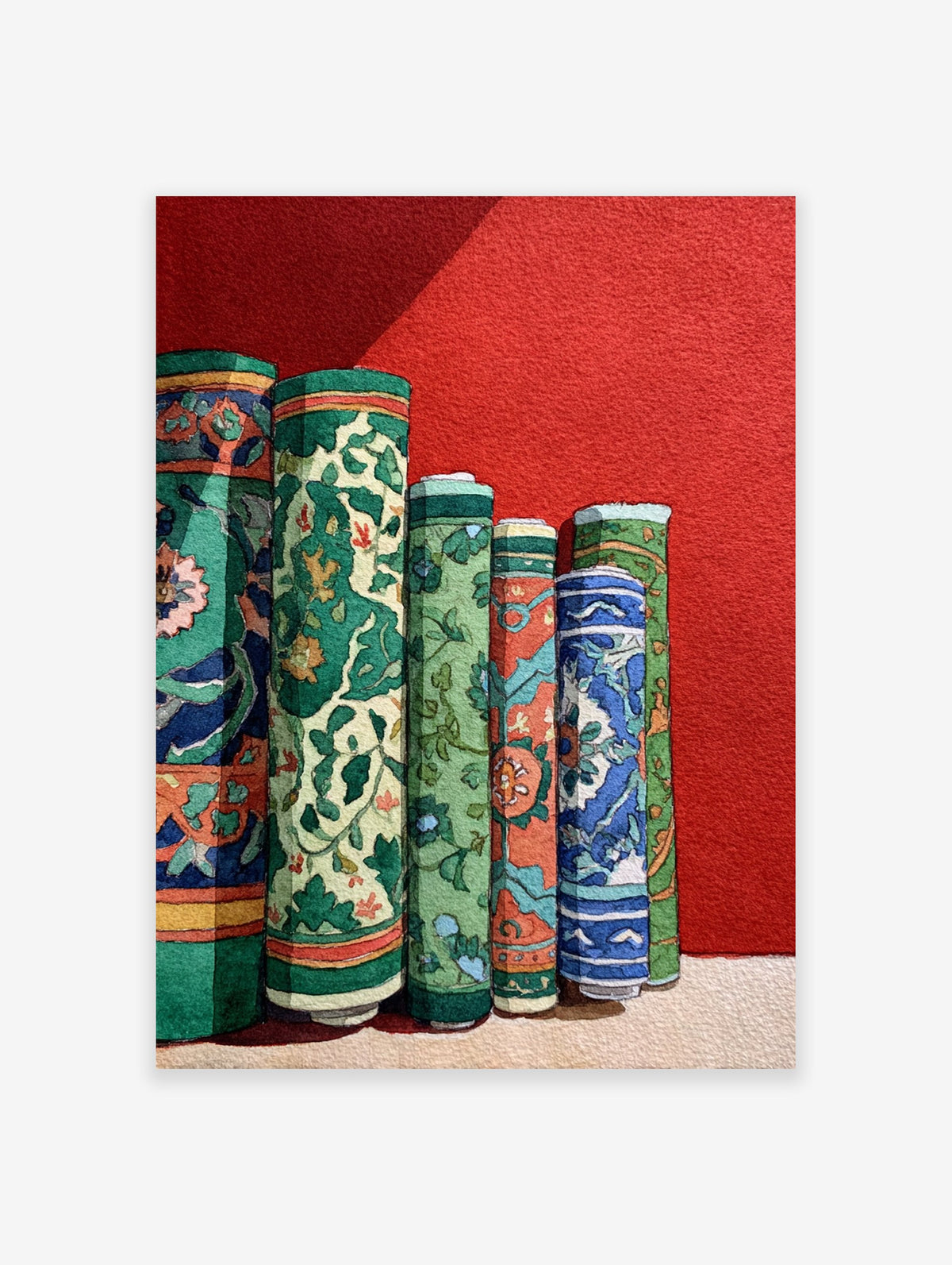 Cultural wall art print depicting several vibrantly patterned, rolled green, blue, and orange textiles against a red wall.