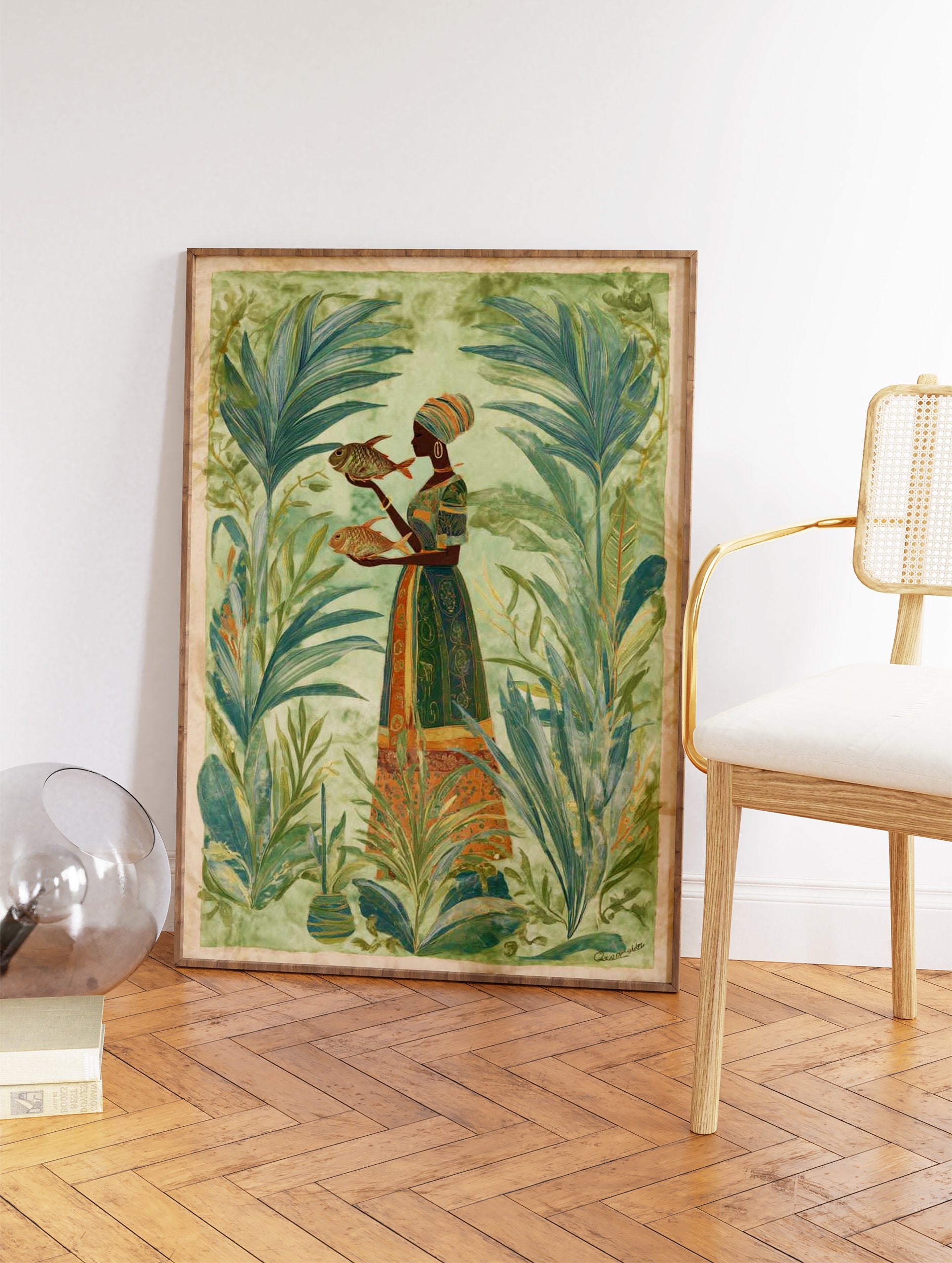 Cultural wall art print of a woman in a tropical setting holding two fish, surrounded by lush green plants. - Image 2