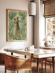 Cultural wall art print of a woman in a tropical setting holding two fish, surrounded by lush green plants. - Image 3