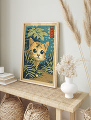 Japanese style illustration of a curious orange kitten with big blue eyes peeking through, in an alternate framed mockup