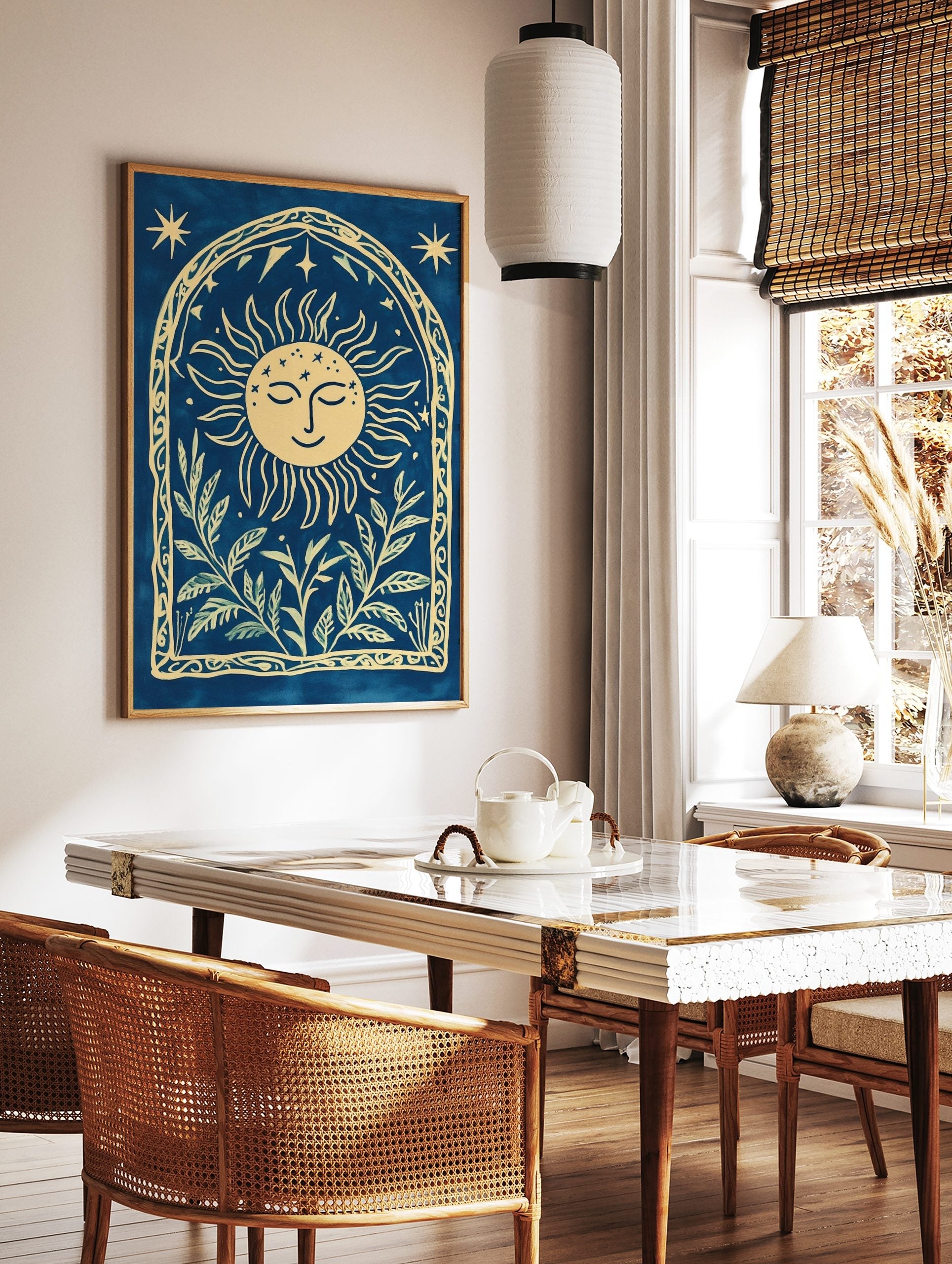 Cyanotype-style wall art with smiling sun, stars, and botanical leaves within an arched decorative, in a styled room mockup