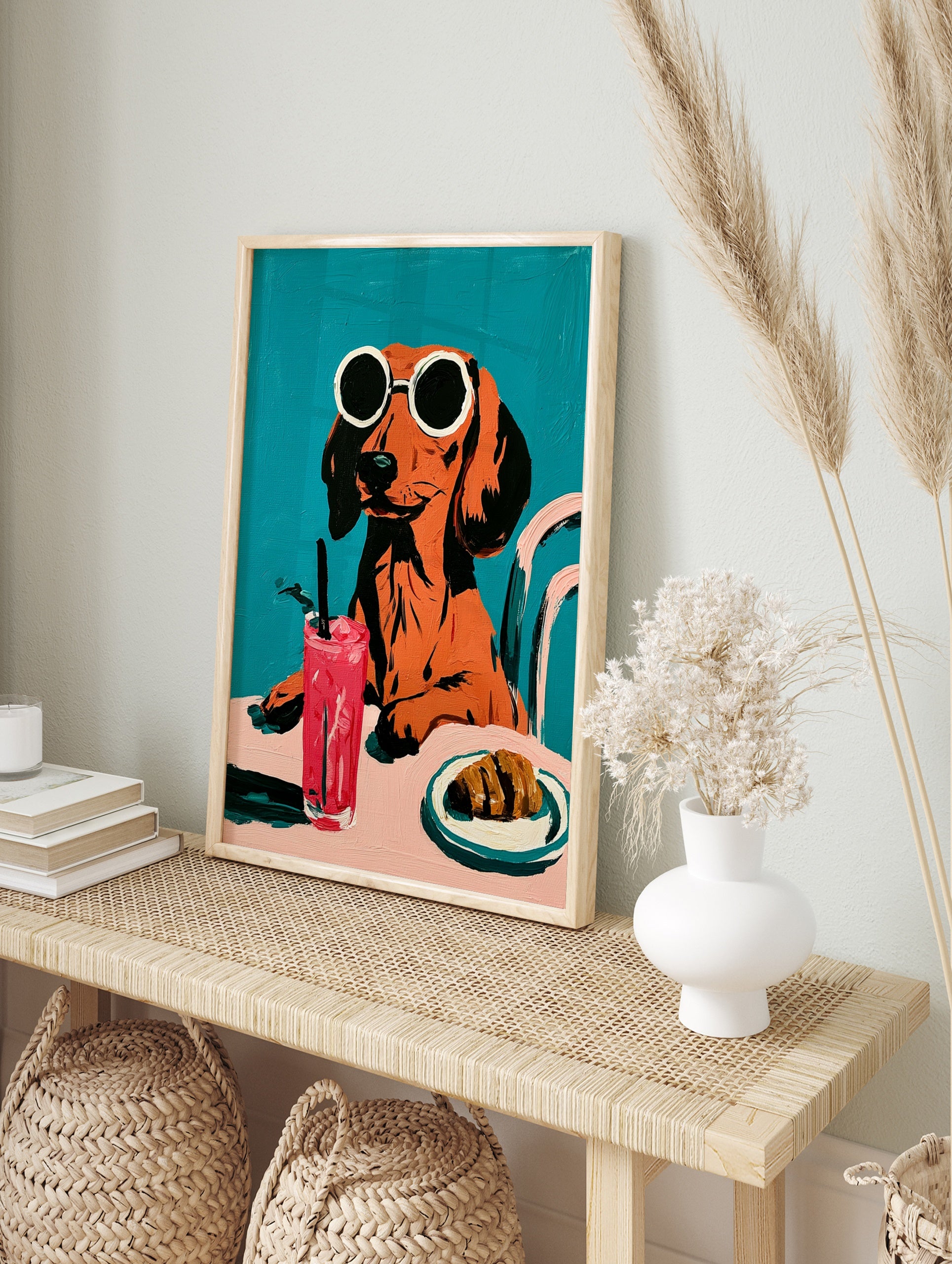 Dachshund in round sunglasses with a pink drink and croissant, illustrative style on a solid, in an alternate framed mockup