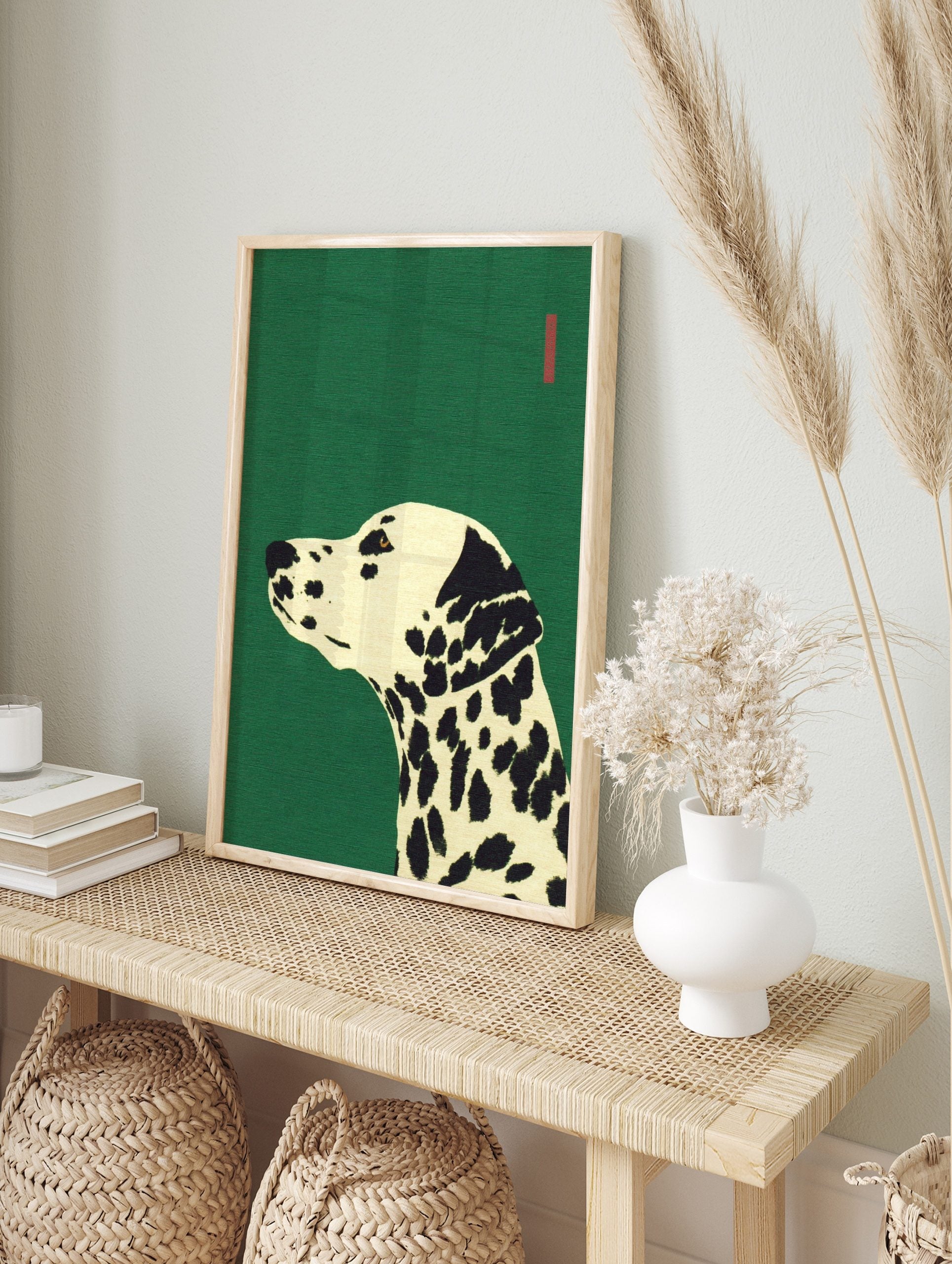 Illustrative Dalmatian dog head and neck in profile on a green background with a red bar, in an alternate framed mockup