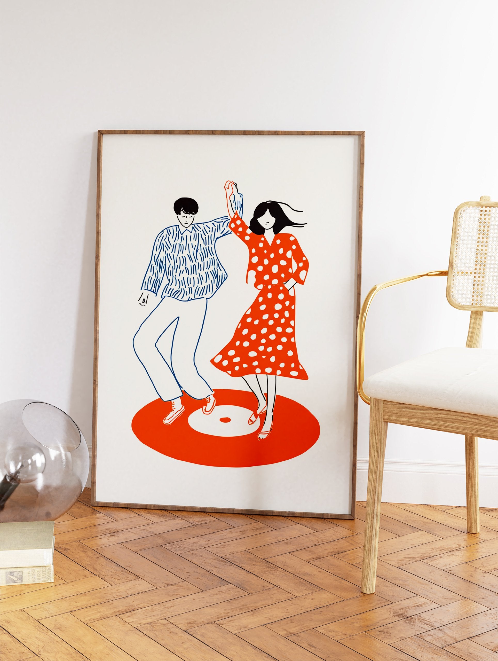 Minimalist illustration of a dancing couple on an orange vinyl record, featuring blue and red retro style. - Image 2