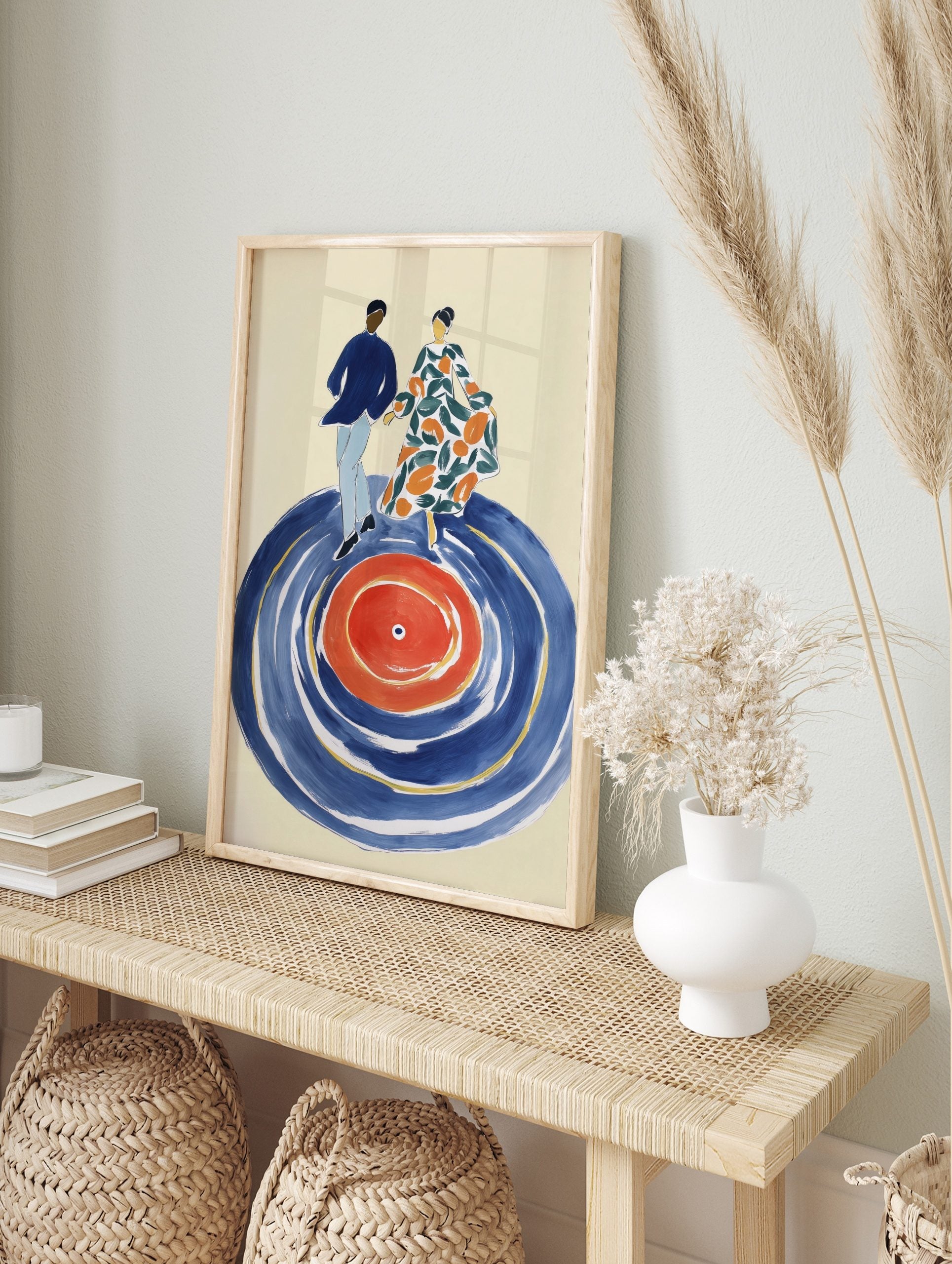 Illustrative art print of a dancing couple on a large blue and red vinyl record with green, in an alternate framed mockup
