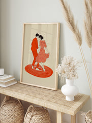 Illustrative print of a dancing couple in red, with a patterned dress and concentric circles, in an alternate framed mockup