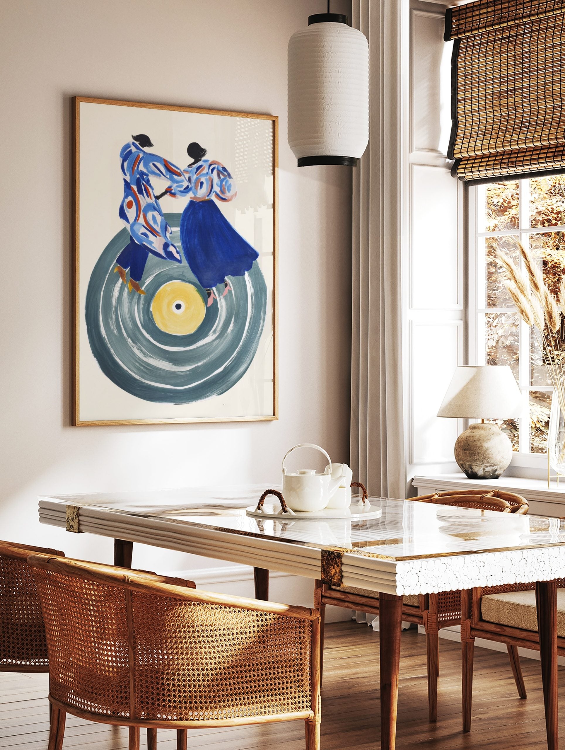 Abstract art print of two stylised figures dancing on a large grey vinyl record with a yellow, in a styled room mockup