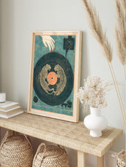 Illustrative print of two dancing tigers on a navy vinyl record with an orange centre and a, in an alternate framed mockup