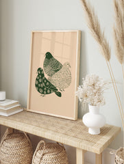 Three dark green illustrative doves with patterned bodies on a light beige background, in an alternate framed mockup