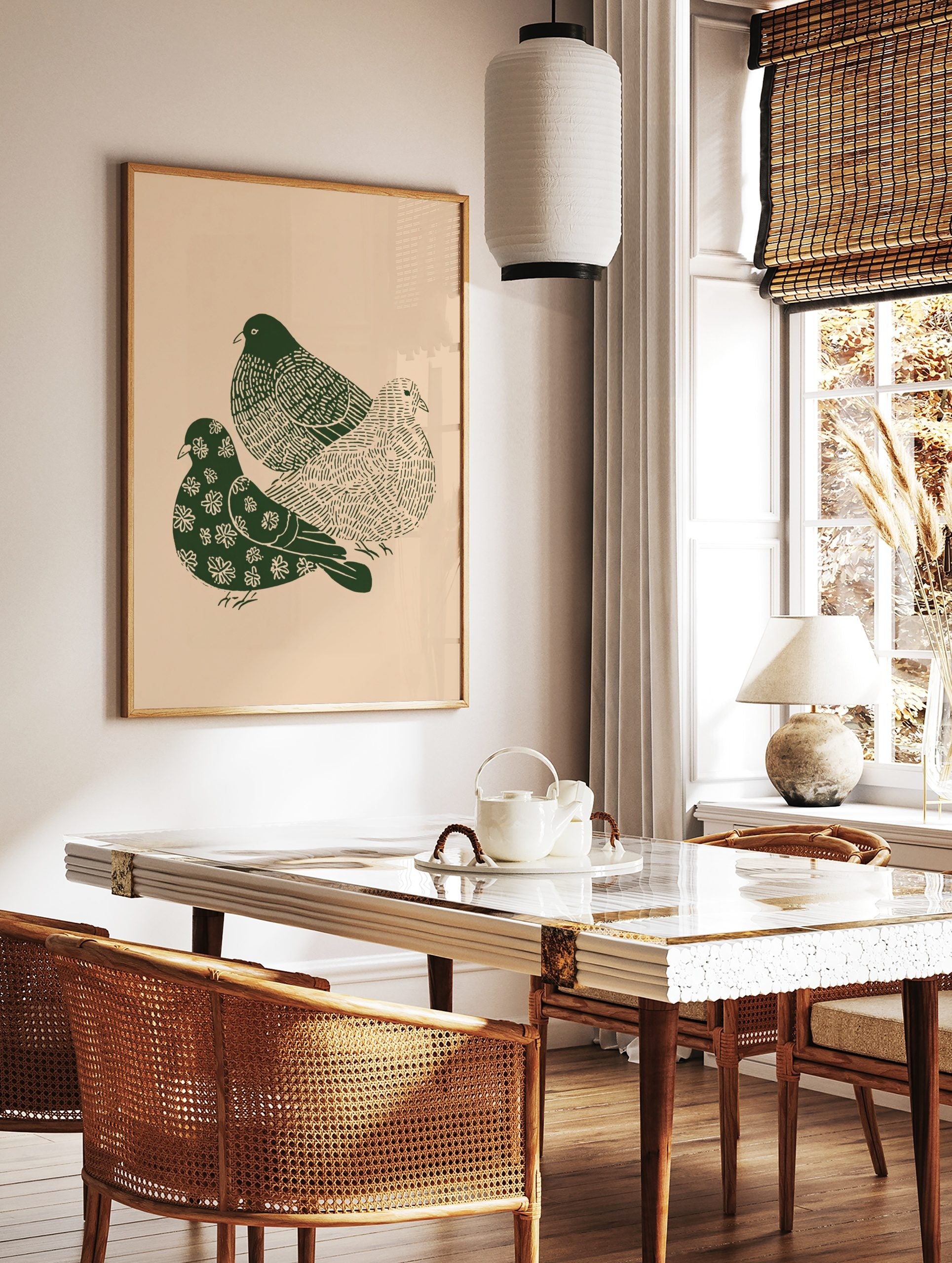 Three dark green illustrative doves with patterned bodies on a light beige background, in a styled room mockup
