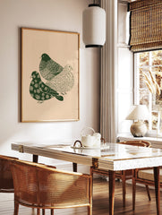 Three dark green illustrative doves with patterned bodies on a light beige background, in a styled room mockup