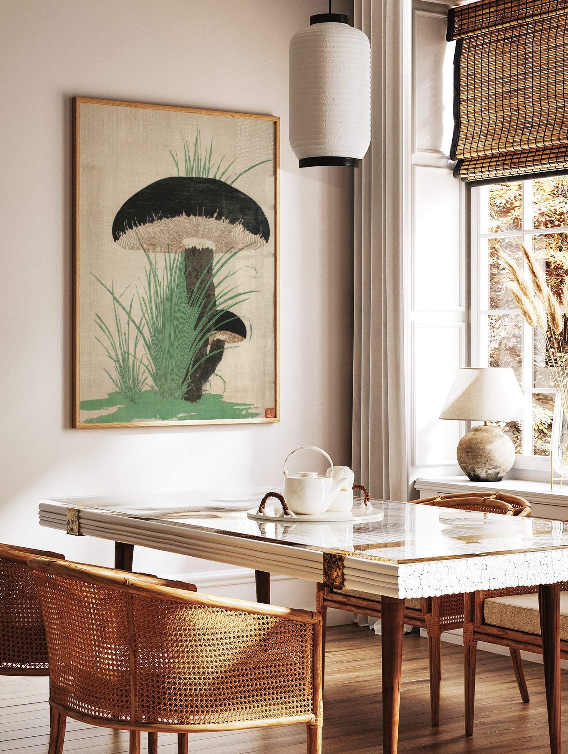 Botanical illustration of two dark-capped mushrooms with gills and green grass on a light background, in a styled room mockup