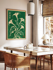 Botanical illustration of white Datura flowers with Japanese calligraphy on a deep green background, in a styled room mockup