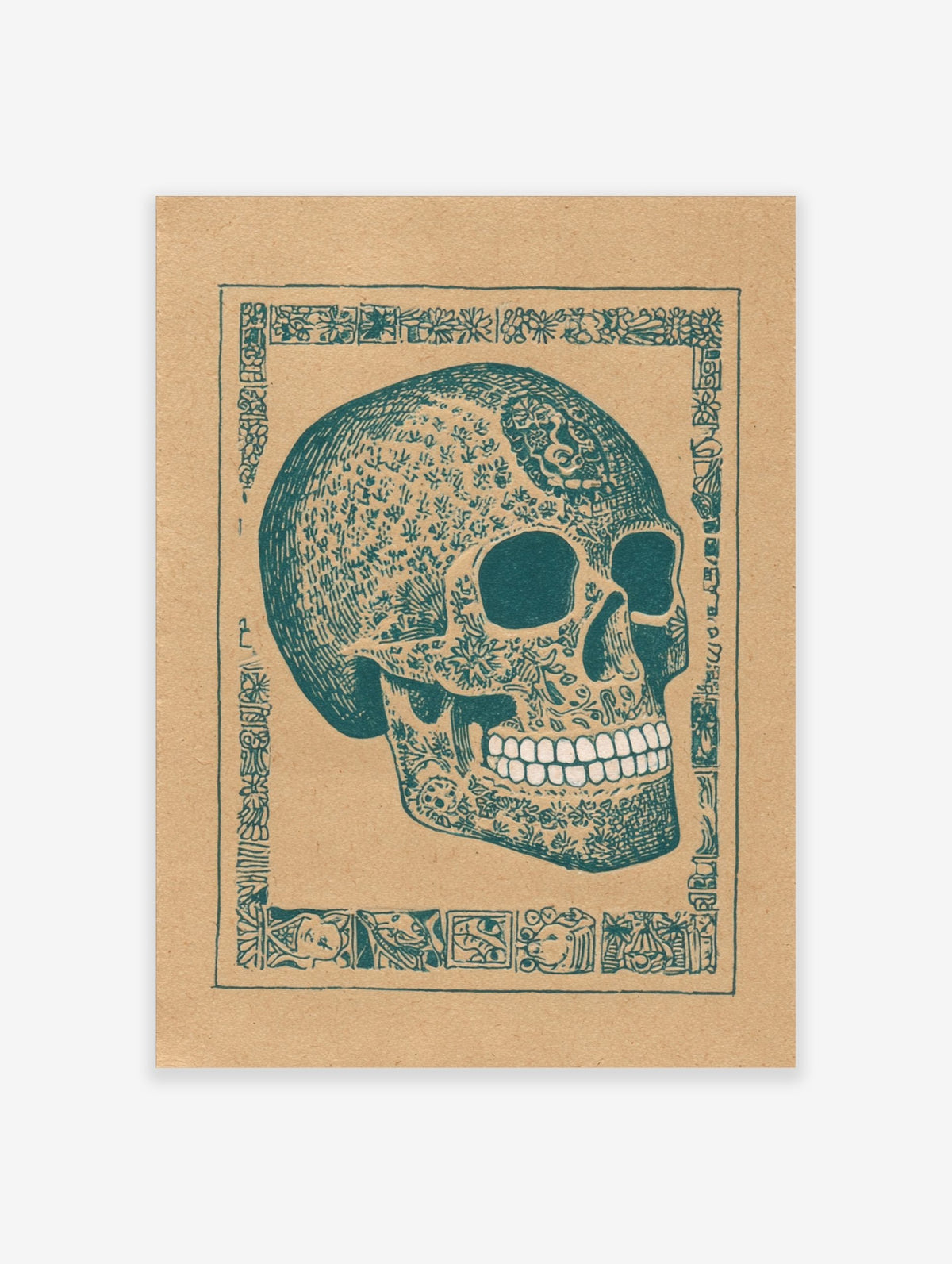 Decorated skull art print with intricate teal patterns on brown paper, framed by an ornate border
