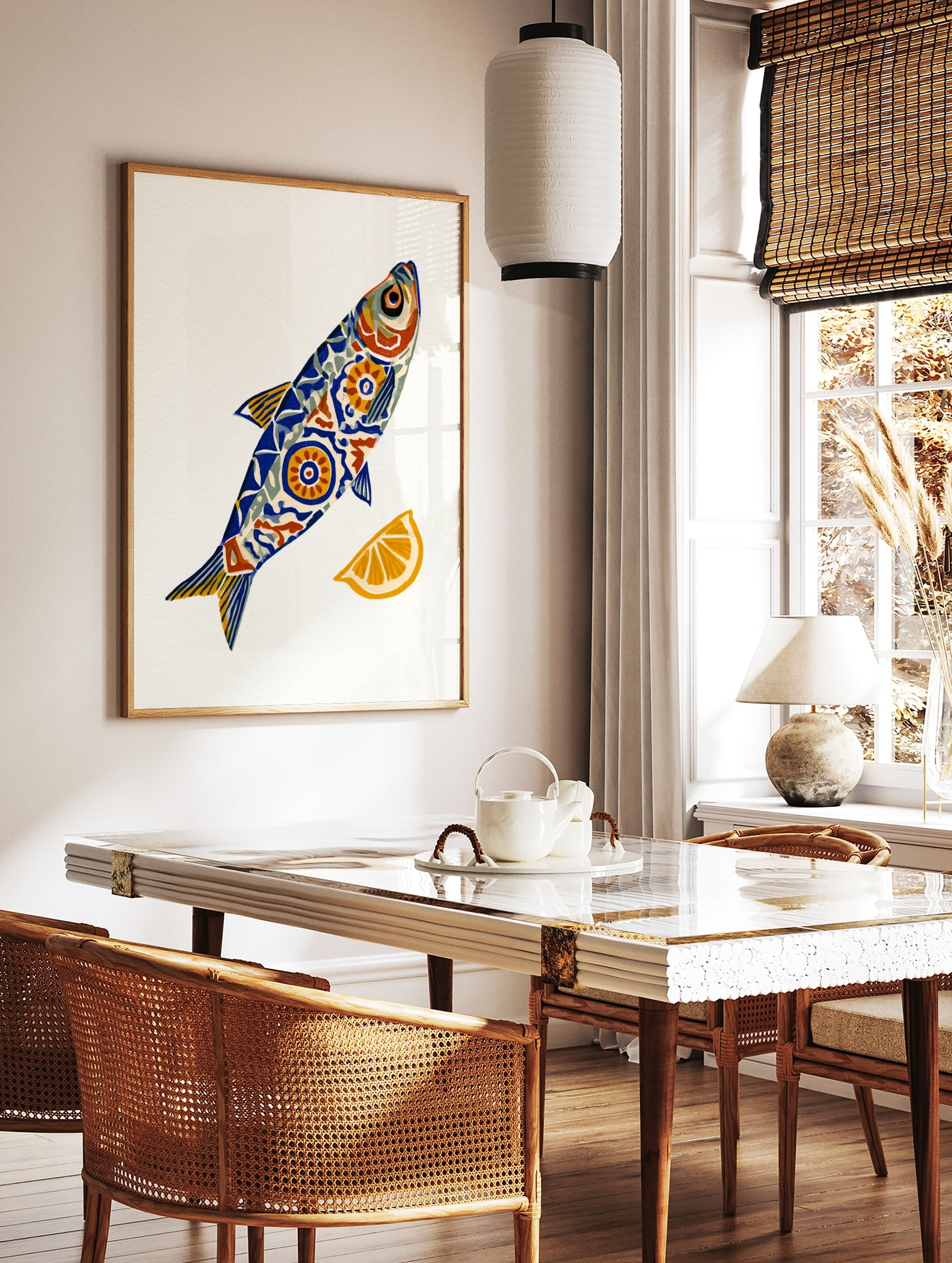 Stylised fish illustration with blue and orange geometric patterns and a lemon slice on a white, in a styled room mockup