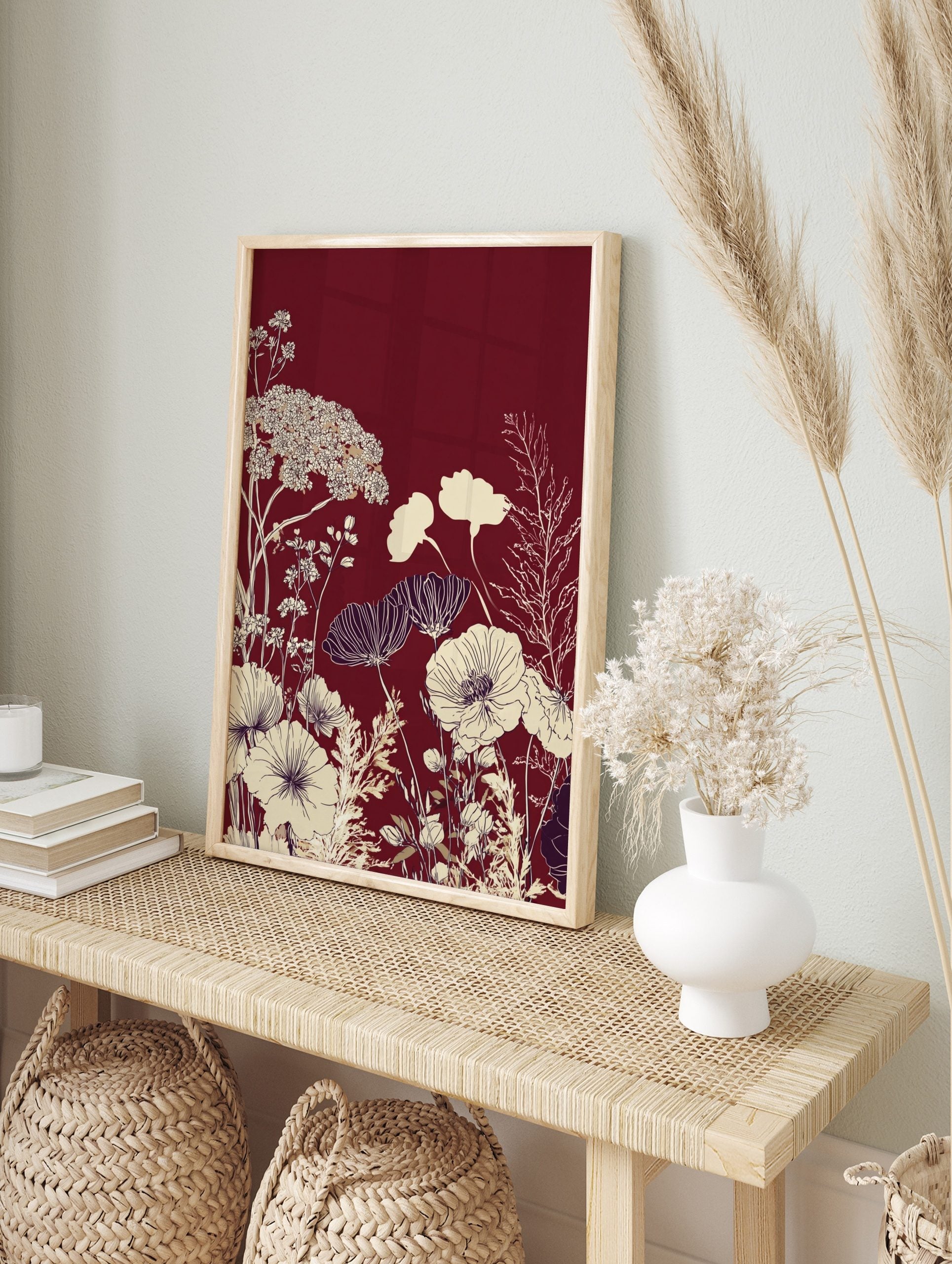 Deep red background with cream and white illustrative botanical poppy flowers and delicate, in an alternate framed mockup