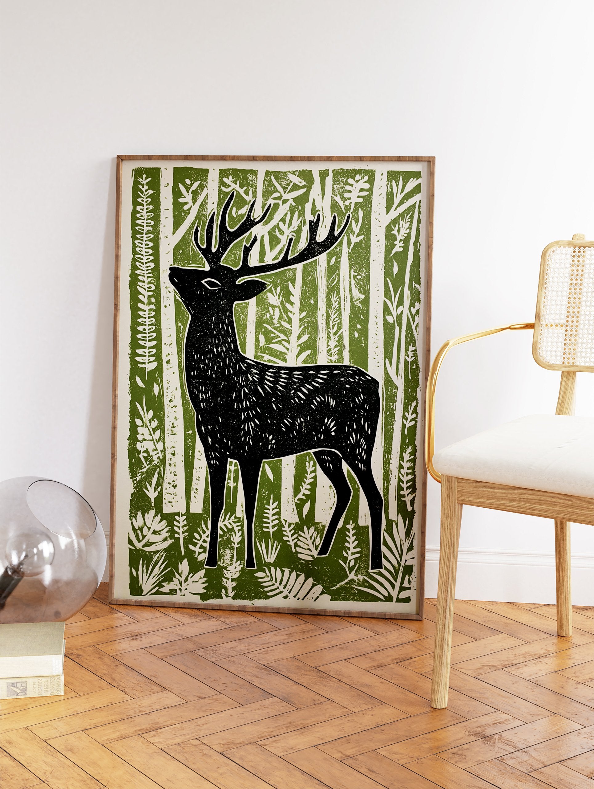 Black deer art print in a linocut style, standing in a green and white forest with stylized trees and foliage. - Image 2