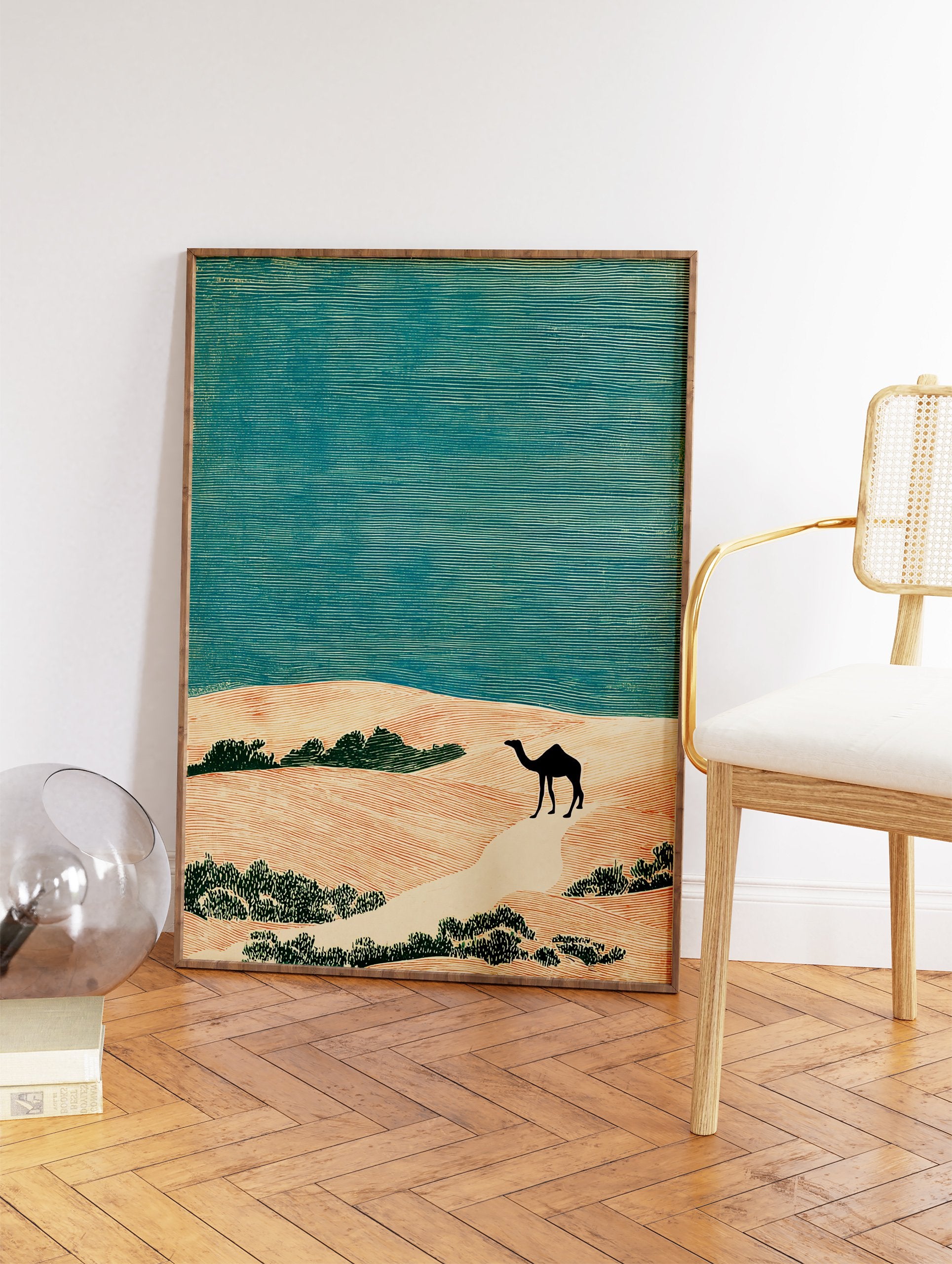 Desert landscape art print with a black camel walking on sand dunes under a teal sky, in a linocut style. - Image 2