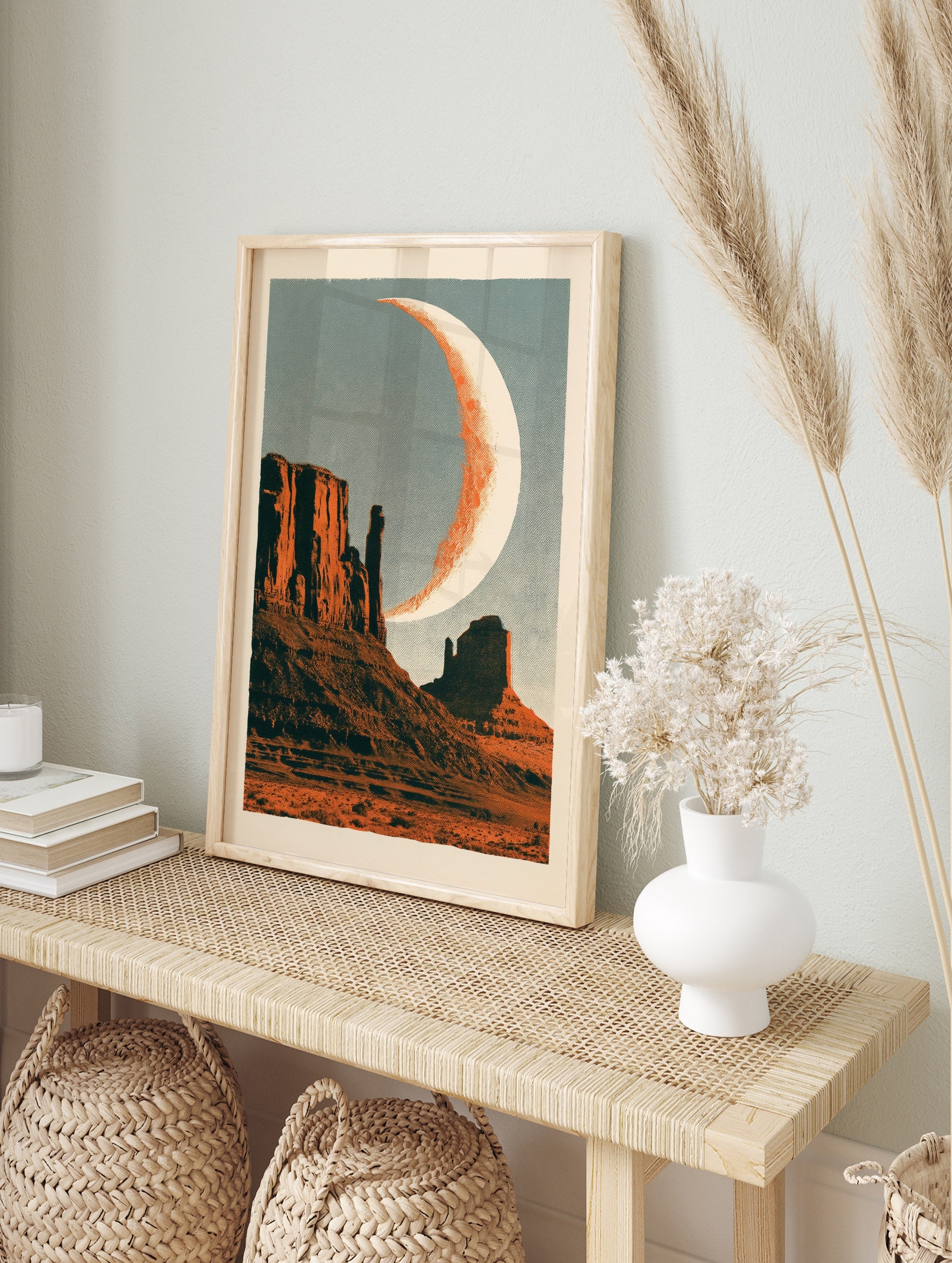 Retro desert landscape wall art featuring mesas and a crescent moon with halftone texture, in an alternate framed mockup