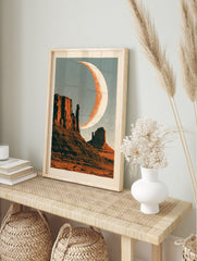 Retro desert landscape wall art featuring mesas and a crescent moon with halftone texture, in an alternate framed mockup