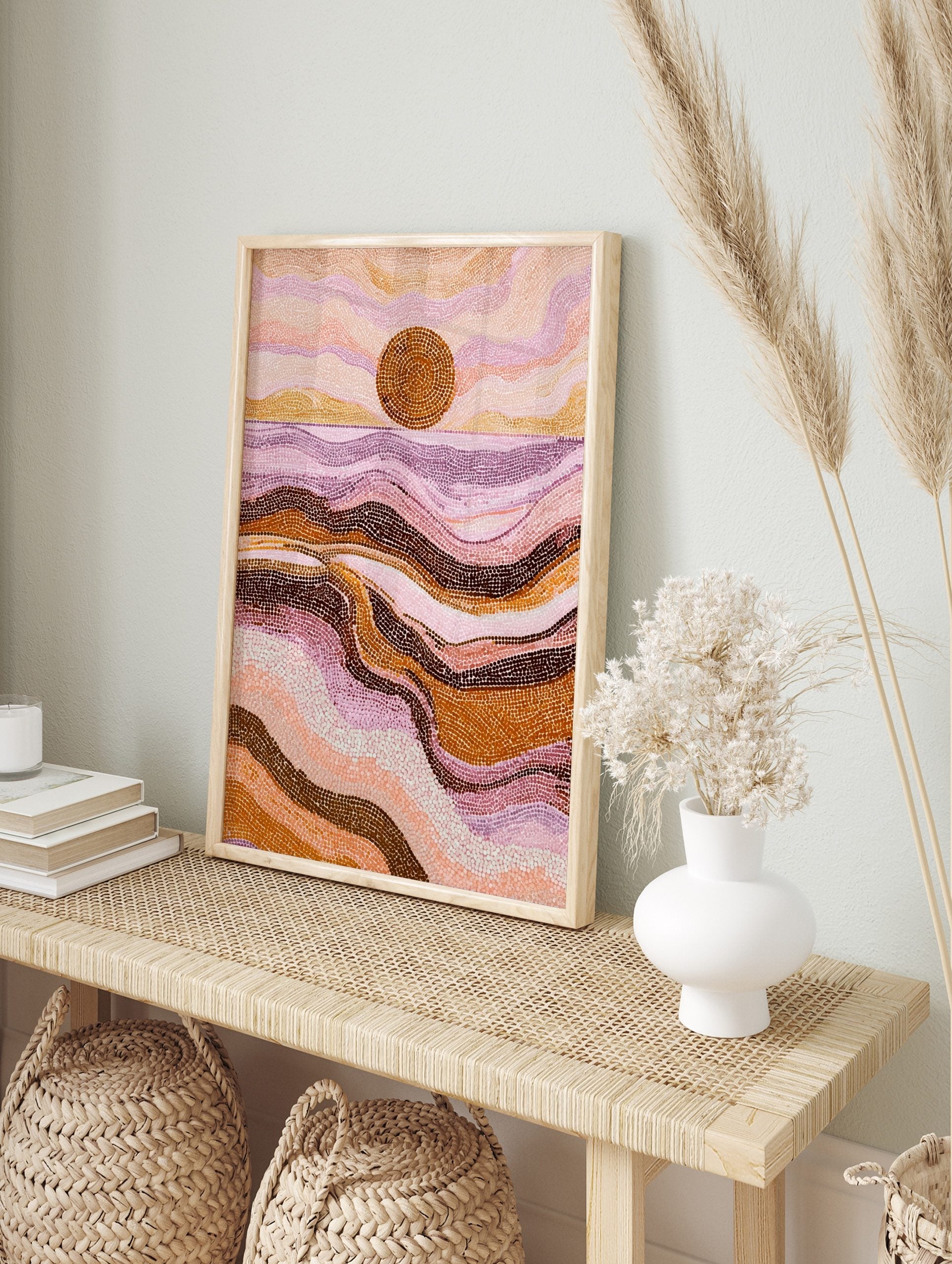 Abstract dot art print of a desert sunset or ocean scene with wavy patterns in pink, purple, in an alternate framed mockup
