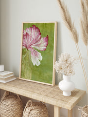 Pink flower illustration with integrated circuit board roots on a solid green background, in an alternate framed mockup