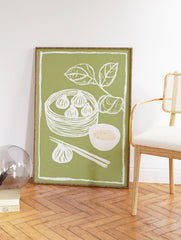 Green dim sum wall art print with white illustrations of dumplings in a steamer, chopsticks, sauce bowl, and leaves. - Image 2
