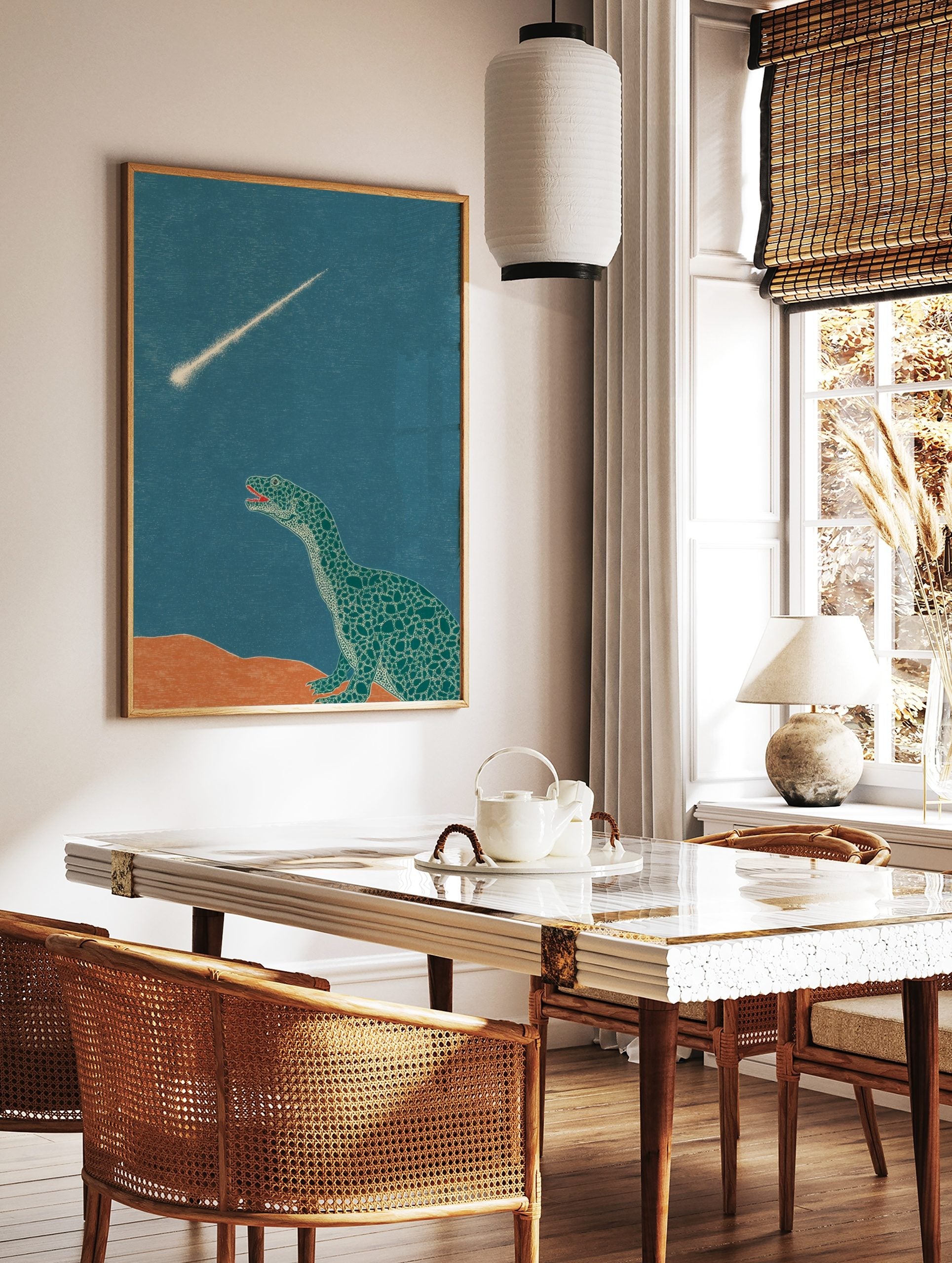 Illustrative dinosaur looking up at a bright meteor streaking across a teal sky with orange ground, in a styled room mockup