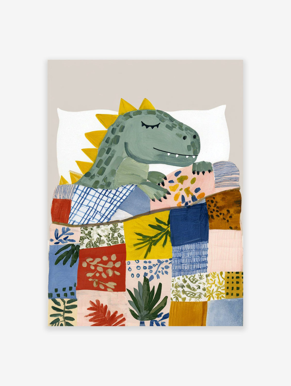 Dinosaur wall art print showing a cute sleeping green dinosaur under a colorful patchwork quilt on a white pillow.
