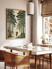 Illustrative print of a motocross rider on a red dirt bike, kicking up dust in a tall green pine, in a styled room mockup