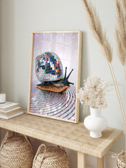 A disco snail poster featuring a snail with a shimmering mirror ball shell on a reflective surface with colorful light reflections. - Image 4