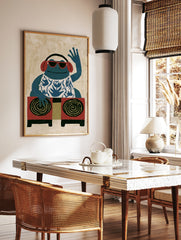 Illustrative blue frog DJ art print wearing red sunglasses and headphones, in a styled room mockup