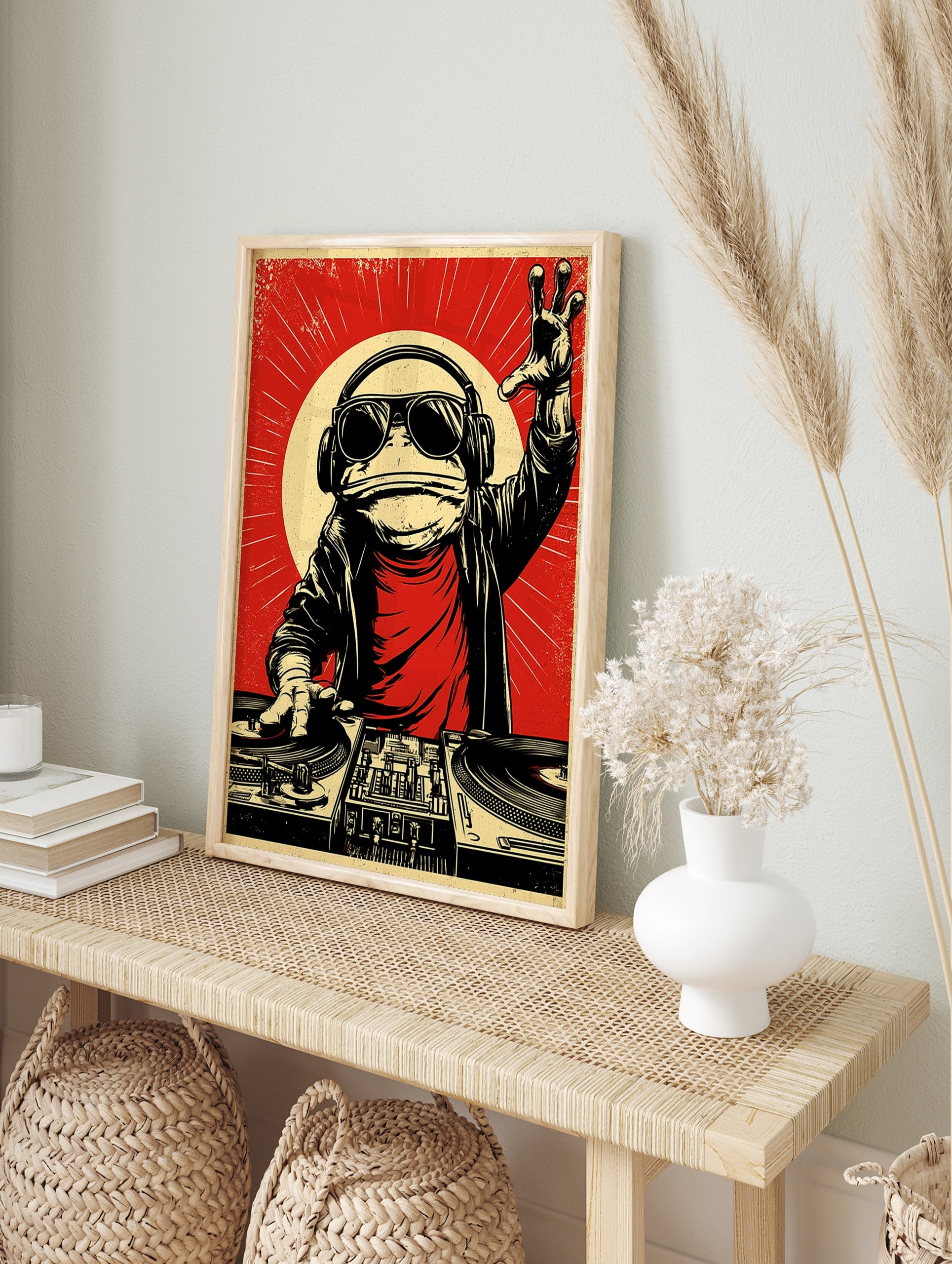 Illustrative DJ frog wearing headphones and sunglasses at a turntable, red background, retro, in an alternate framed mockup