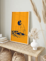 Illustrative orange and blue DJ wall art print featuring a person mixing on turntables with, in an alternate framed mockup