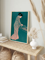 Illustration of a woman in a patterned kimono and headphones mixing on a turntable in a teal, in an alternate framed mockup
