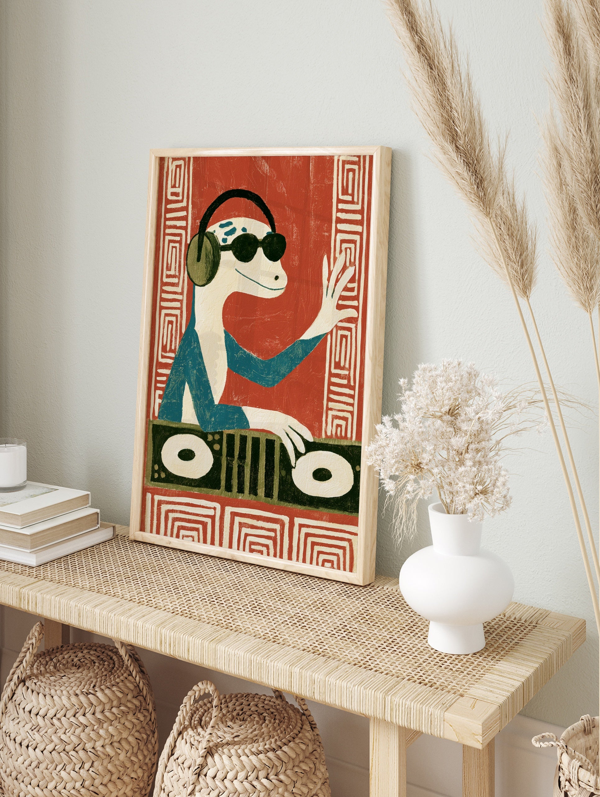 DJ lizard wearing headphones and sunglasses, playing a turntable, illustrative art print on a, in an alternate framed mockup