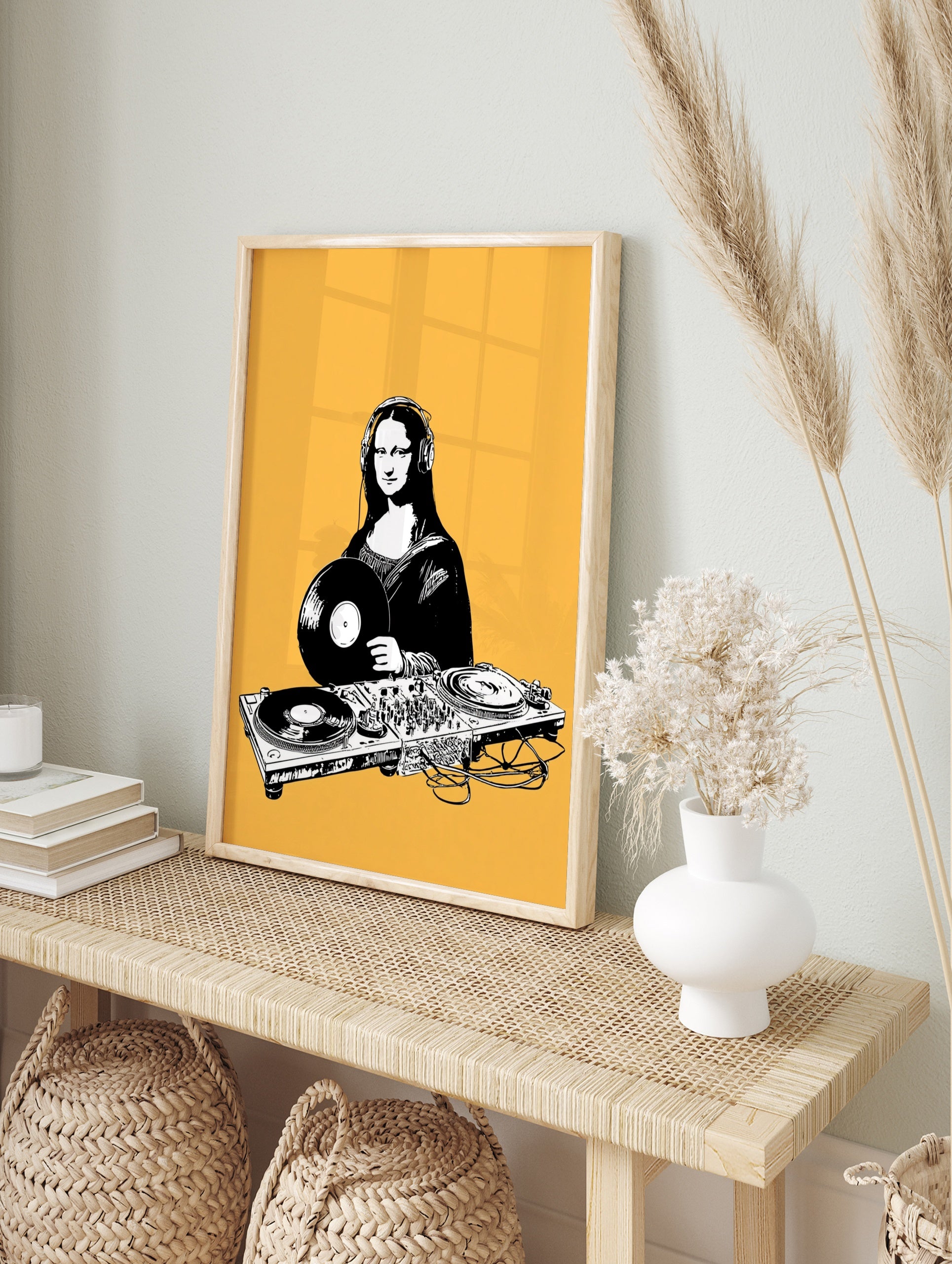 DJ Mona Lisa illustration with headphones and turntable, black and white art print on a solid, in an alternate framed mockup