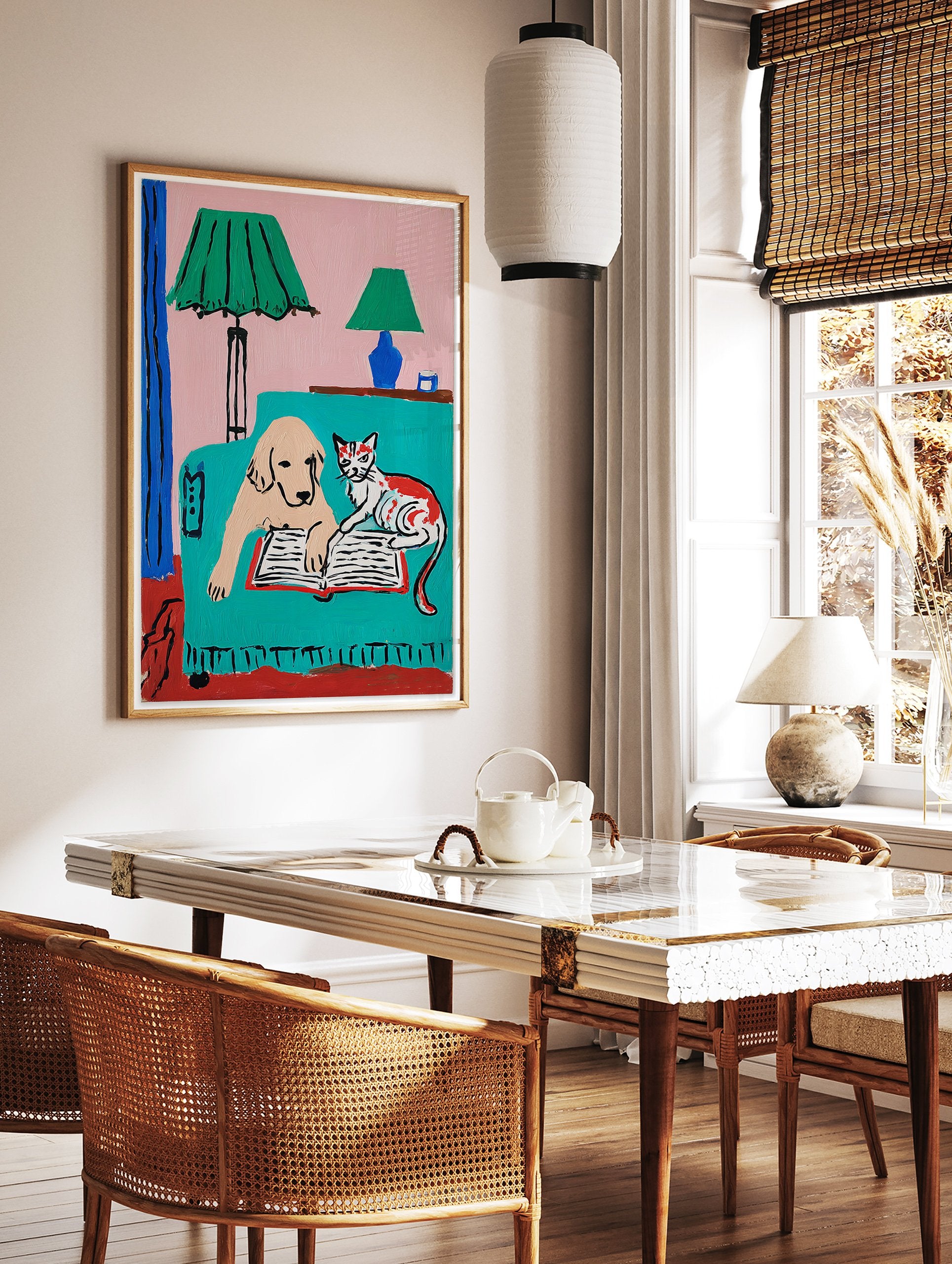 Colorful dog and cat reading a book on a teal couch under green lamps, a whimsical pet illustration art print. - Image 2