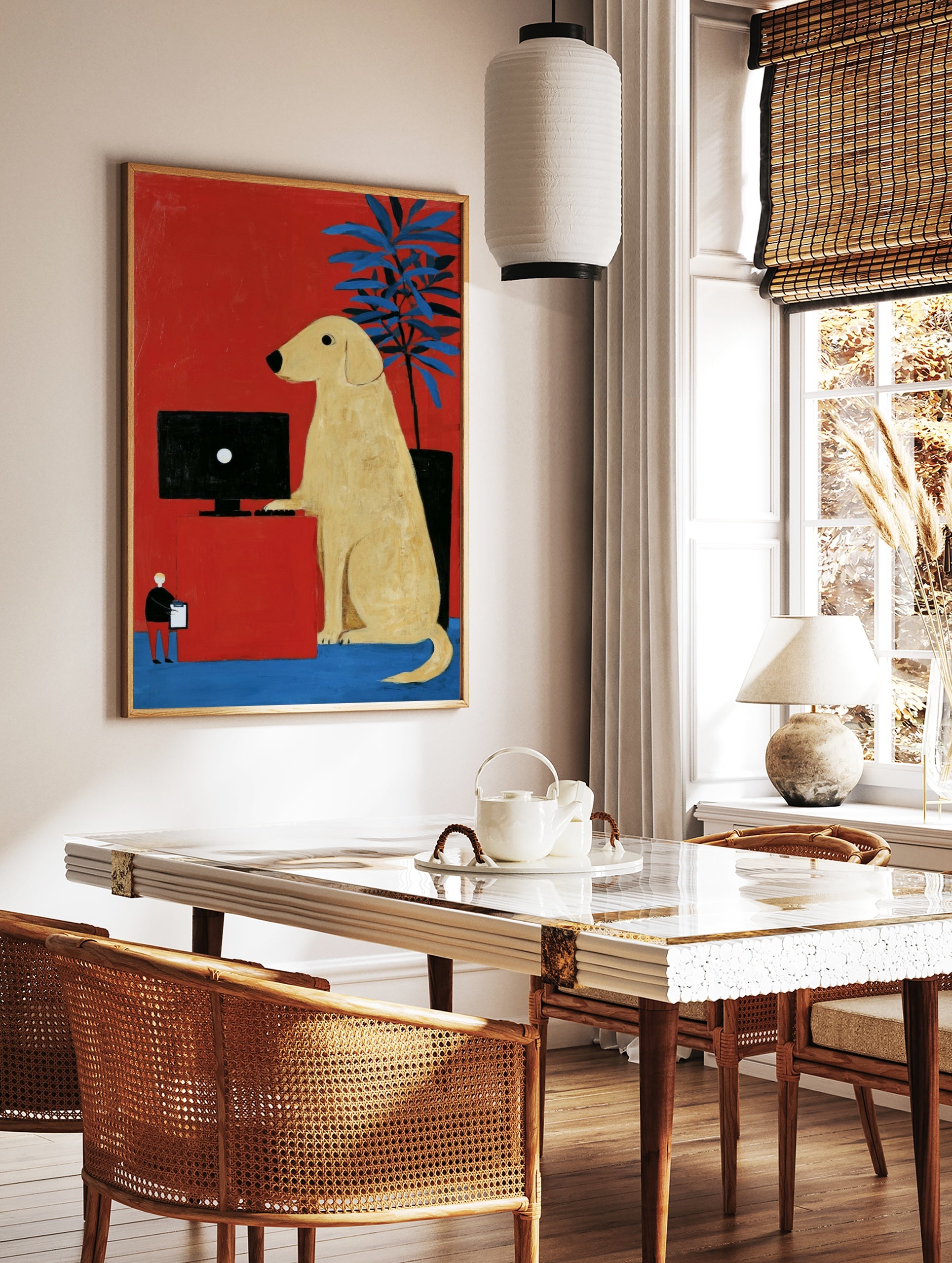 Illustrative art print of a yellow dog at a computer desk against a red background with a blue, in a styled room mockup