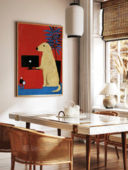 Illustrative art print of a yellow dog at a computer desk against a red background with a blue, in a styled room mockup