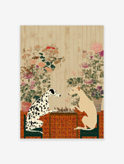 Dalmatian and sighthound dogs playing chess on a table with a patterned cloth and botanical wall art