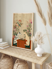 Dalmatian and sighthound dogs playing chess on a table with a patterned cloth and botanical, in an alternate framed mockup