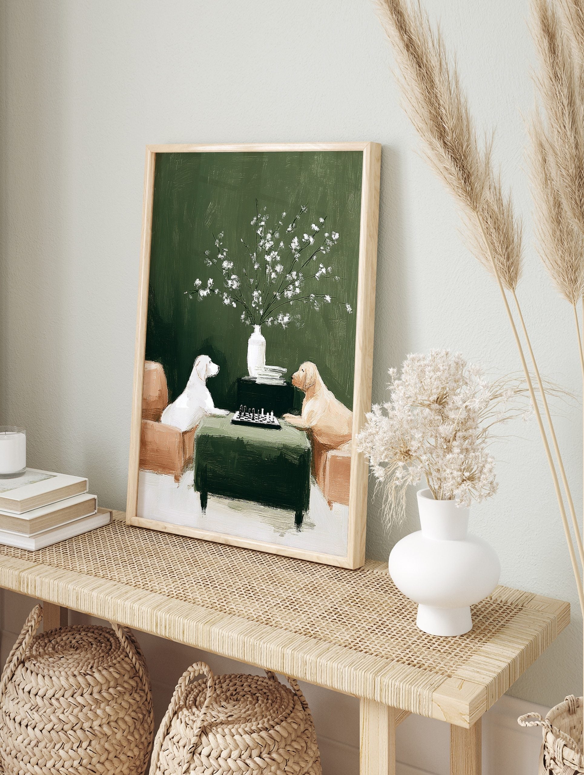 Illustrative print of two dogs, a white Labrador and a golden retriever, playing chess on a, in an alternate framed mockup