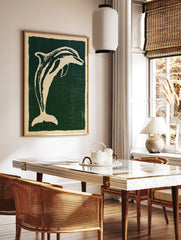 Stylised cream dolphin illustration on a deep green background, illustrative animal wall art print, in a styled room mockup